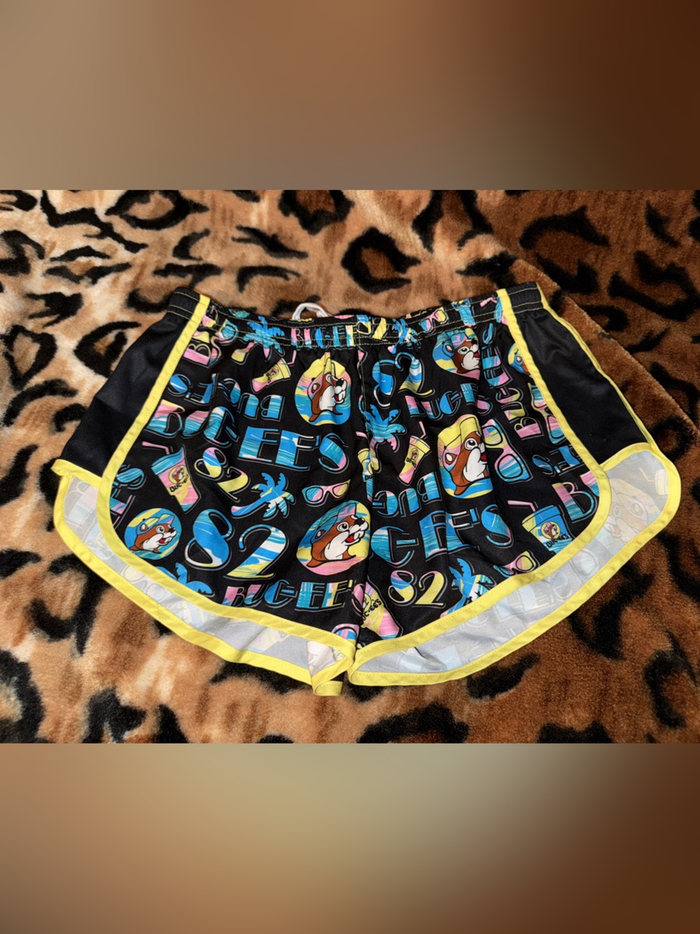 Women’s Black Buc-ees  Shorts with Yellow Trim and Colorful Graphic Print